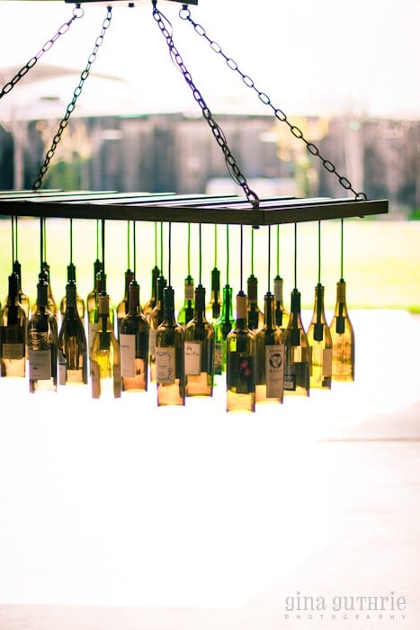 30 Wine Bottle Light Chandelier Hanging from Wood Rack